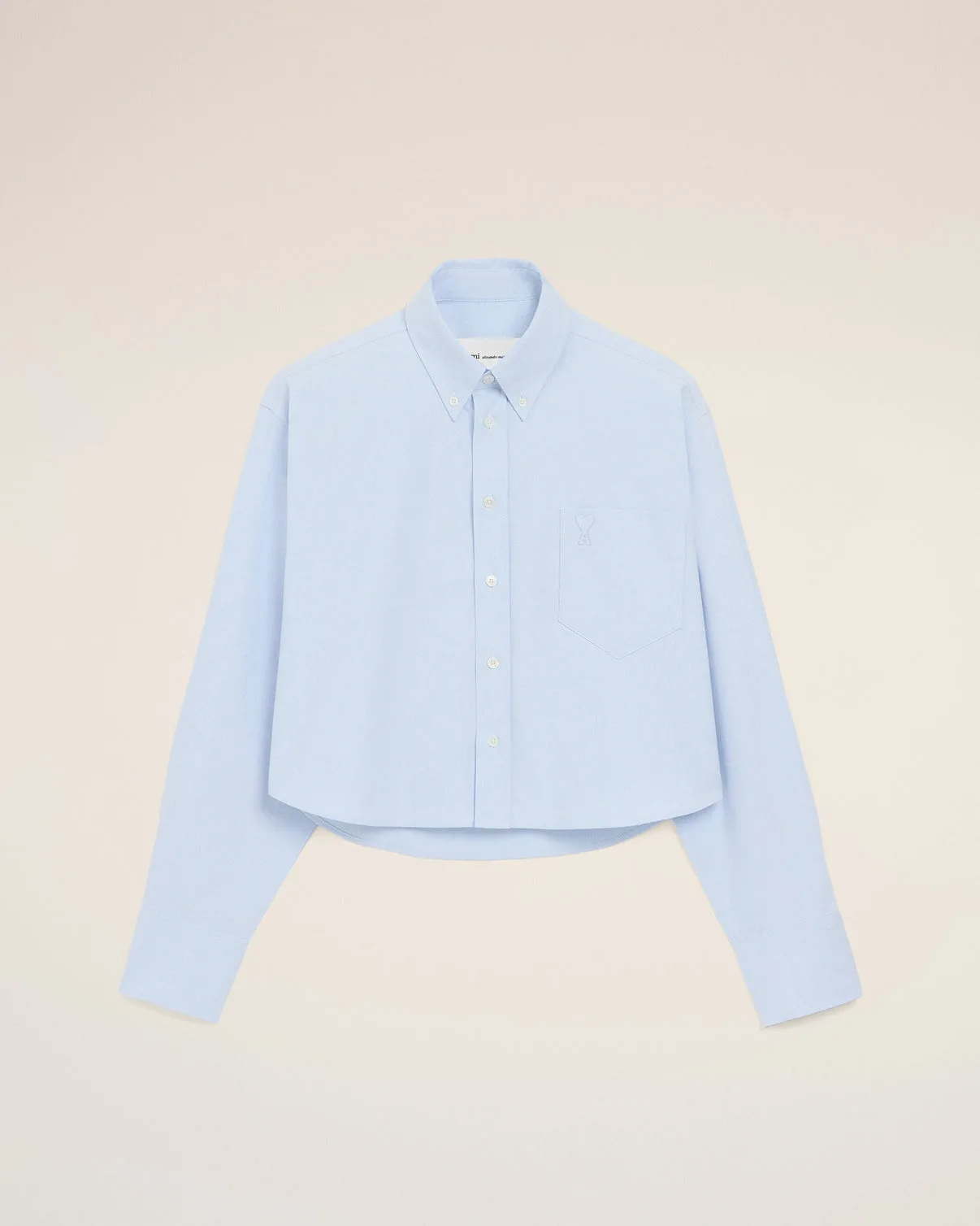 Blue cropped cotton shirt with embossed