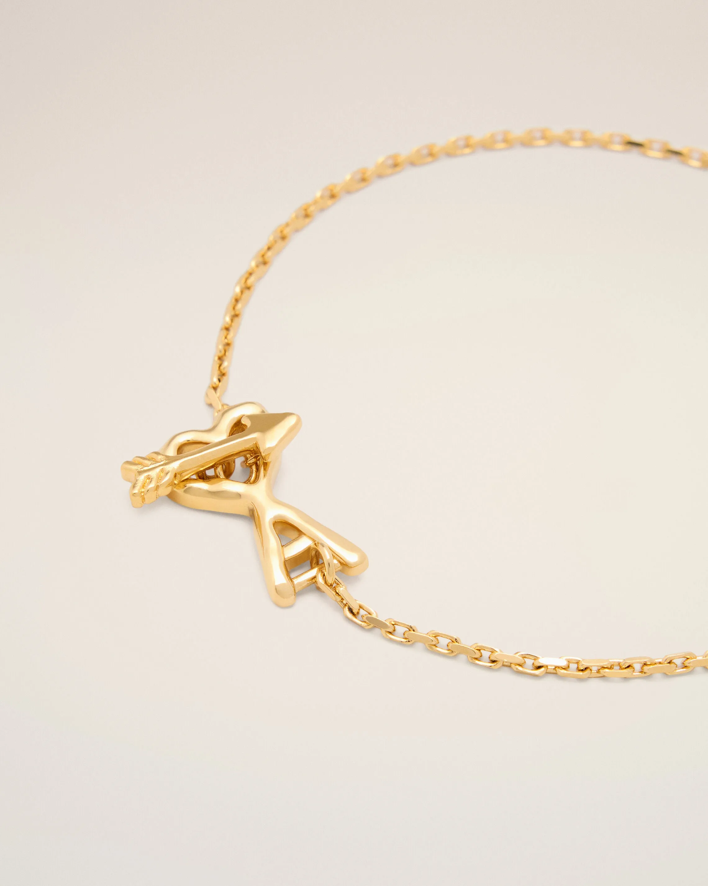 Gold brass bracelet with hammered heart arrow