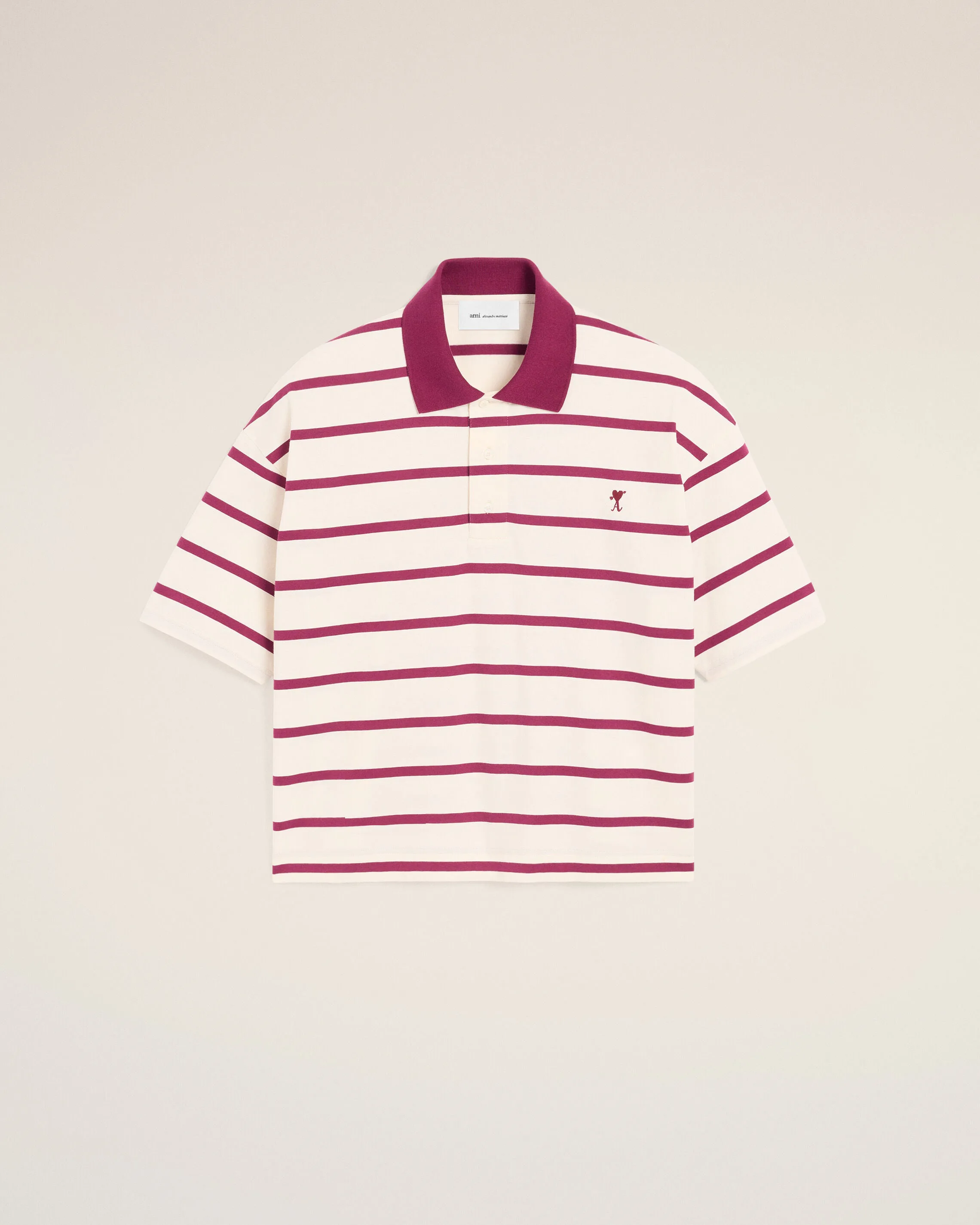 White cotton polo with heart arrow