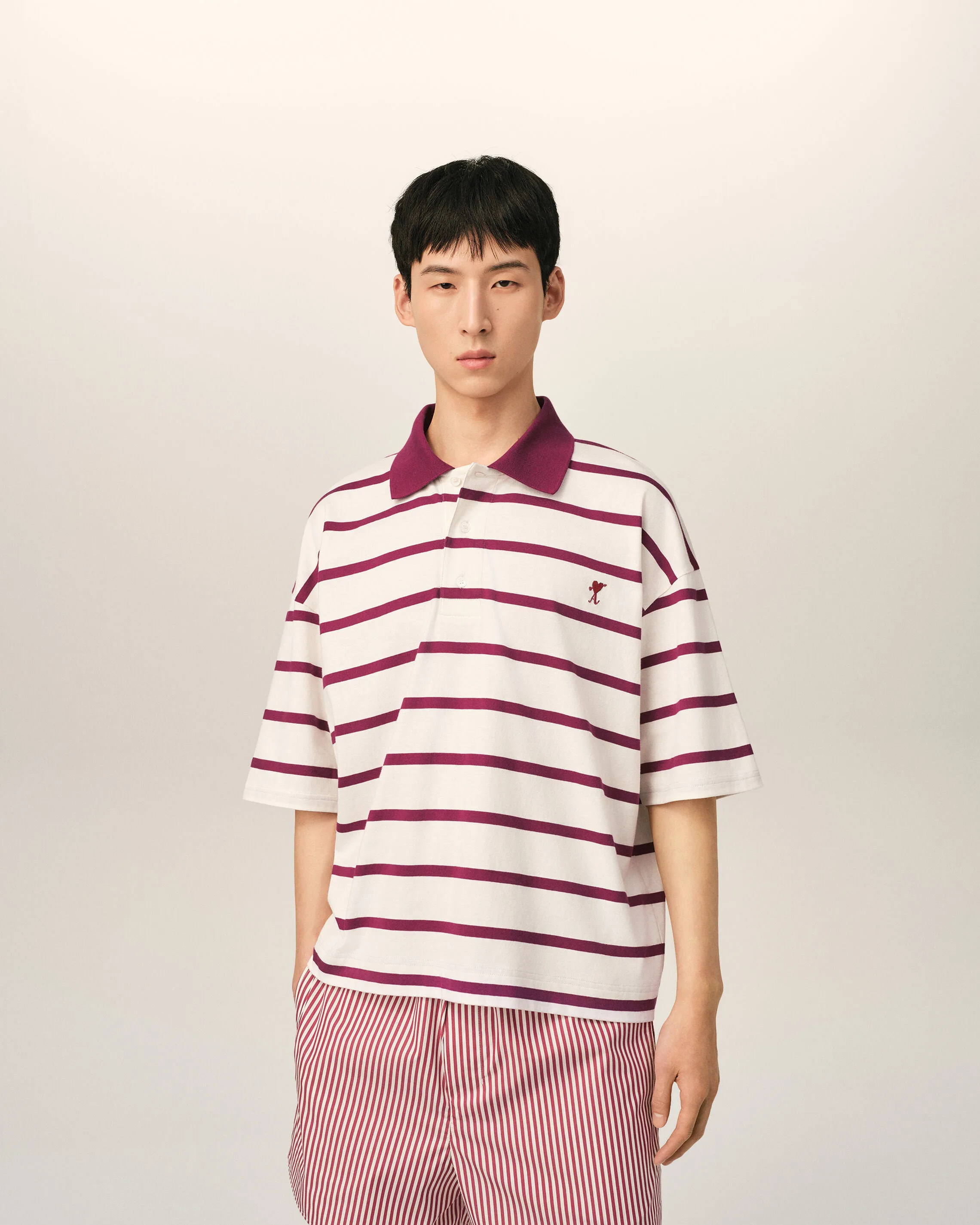 White cotton polo with heart arrow