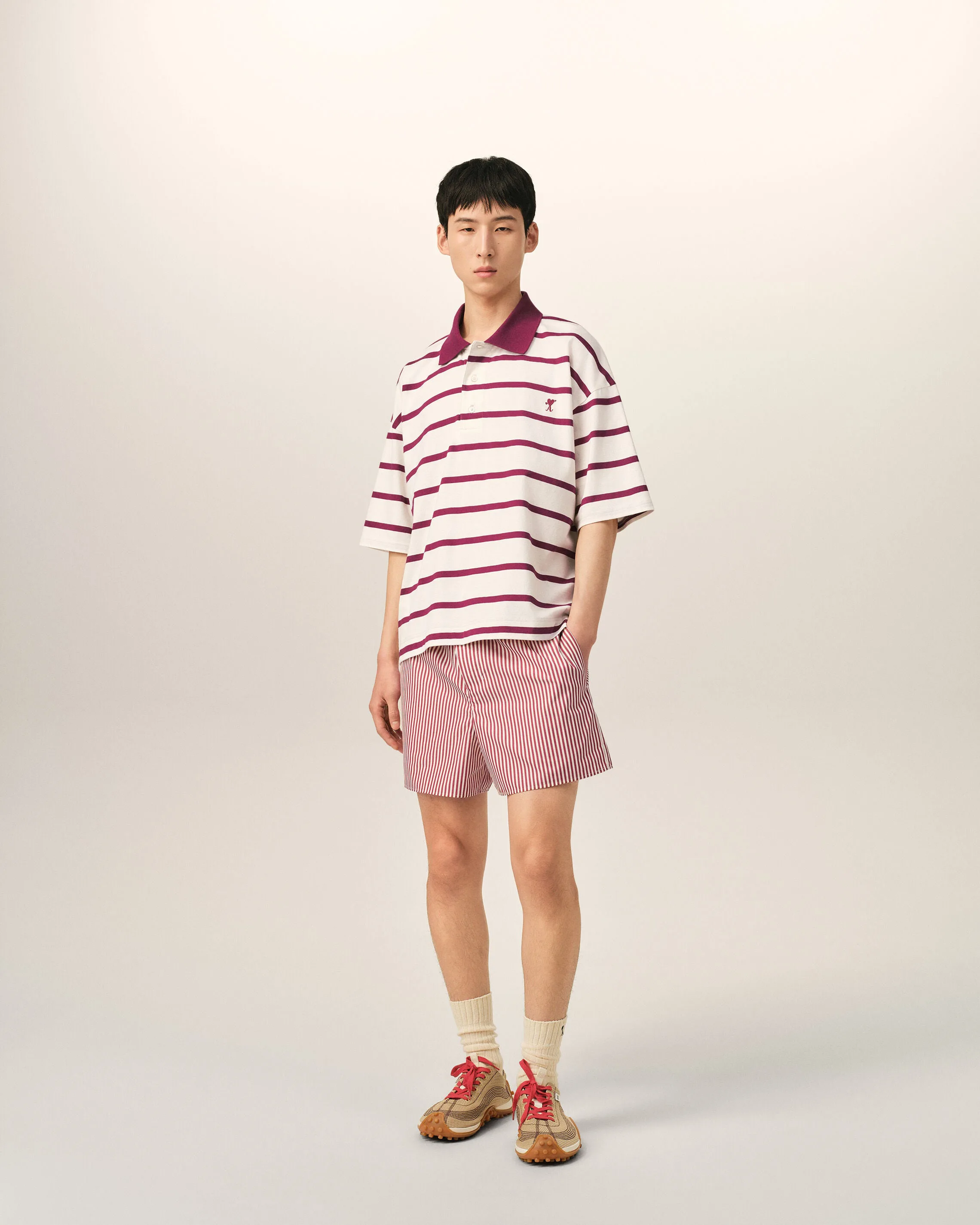 White cotton polo with heart arrow